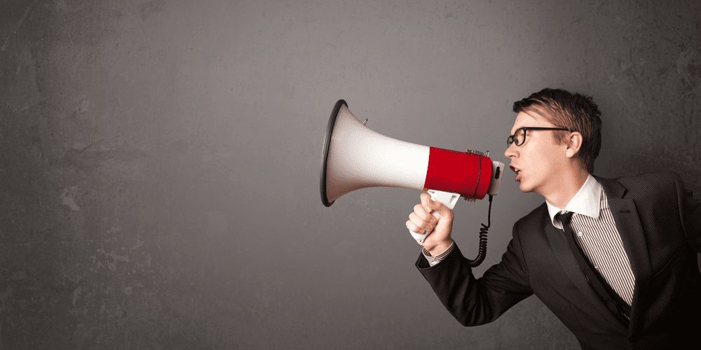 person speaking on megaphone