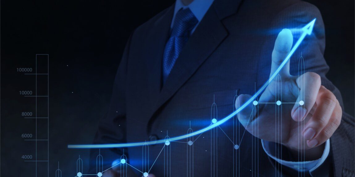 a business man touching the rising graph chart
