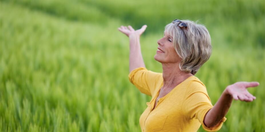 a old person rising her hand