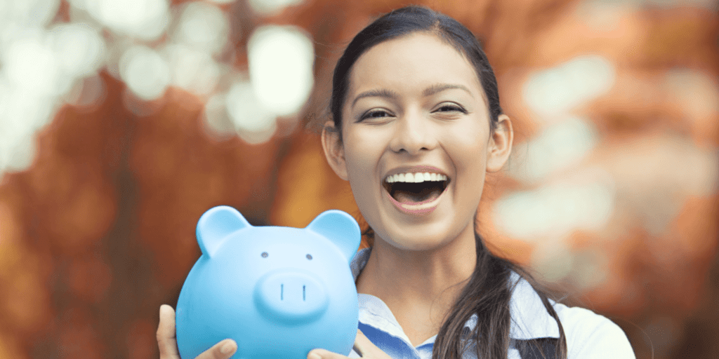 image of a person laughing with a blue piggy bank