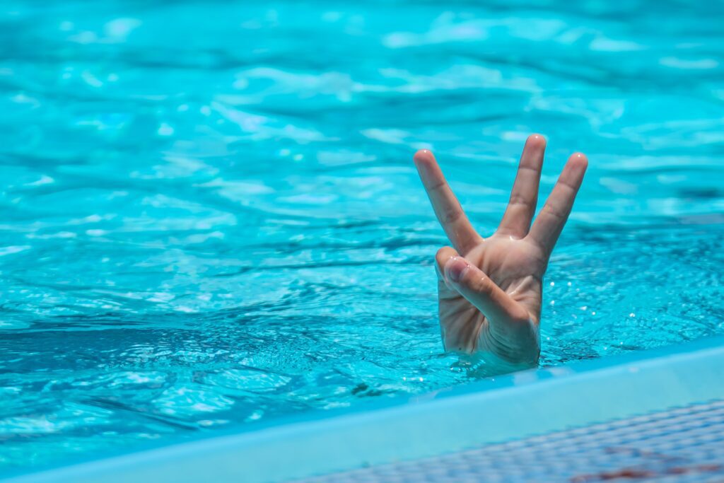 a person hand in the swimming pool