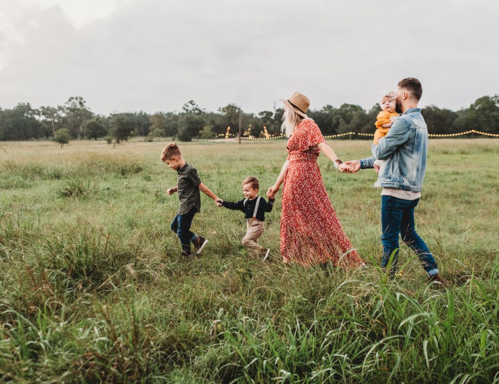 group of family walking in grass land