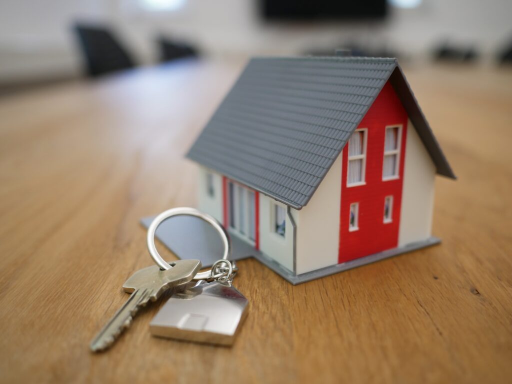 image of miniature house with key